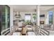 Inviting outdoor kitchen and dining area with stainless steel grill, fireplace, and comfortable seating at 3559 Santa Caterina Blvd, Bradenton, FL 34211