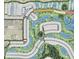 Aerial community view showcasing lush greenery, winding roads, and well-planned residential layout with lakes and golf course at 3563 Santa Caterina Blvd, Bradenton, FL 34211