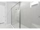 Modern bathroom features a tiled shower with a glass enclosure and bench seat at 3563 Santa Caterina Blvd, Bradenton, FL 34211