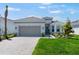 Beautiful one story home features a two car garage, landscaping and brick driveway at 3563 Santa Caterina Blvd, Bradenton, FL 34211