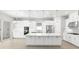 Modern kitchen with large island, stainless steel appliances, and white cabinetry at 3563 Santa Caterina Blvd, Bradenton, FL 34211