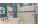 Modern bathroom featuring glass enclosed shower, dual shower heads, updated vanity, and artistic wall decor at 3575 Santa Caterina Blvd, Bradenton, FL 34211