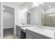 Elegant bathroom with double sinks, quartz countertops, and framed mirrors at 3575 Santa Caterina Blvd, Bradenton, FL 34211