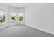 Bright bedroom with three large windows offering pleasant neighborhood views and neutral carpet at 3575 Santa Caterina Blvd, Bradenton, FL 34211