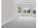 Spacious bedroom features a tray ceiling, neutral carpet, and large windows for ample natural light at 3575 Santa Caterina Blvd, Bradenton, FL 34211