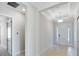 Welcoming foyer with elegant lighting, detailed trim and open layout at 3575 Santa Caterina Blvd, Bradenton, FL 34211