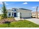 Beautiful home showcasing a well-manicured front yard with green lawn at 3575 Santa Caterina Blvd, Bradenton, FL 34211