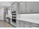 Well-equipped kitchen with gray cabinets, stainless steel appliances, and quartz countertops at 3575 Santa Caterina Blvd, Bradenton, FL 34211