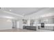 Spacious open-concept layout with kitchen, dining, and living areas featuring modern finishes and plenty of natural light at 3575 Santa Caterina Blvd, Bradenton, FL 34211