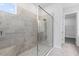 Beautiful tile shower with glass door, bench, and modern fixtures at 3575 Santa Caterina Blvd, Bradenton, FL 34211