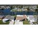 Aerial view of waterfront community showing proximity to canal and neighboring homes at 3805 Baden Dr, Holiday, FL 34691