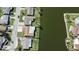 Aerial view of homes in waterfront community showcasing canals and docks at 3805 Baden Dr, Holiday, FL 34691