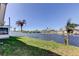 Waterfront backyard with lush grass and picturesque views of the canal at 3805 Baden Dr, Holiday, FL 34691