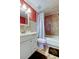 A charming bathroom featuring a combination shower and tub with tasteful, light-colored marble tile at 3805 Baden Dr, Holiday, FL 34691