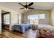 Bright bedroom featuring hardwood floors, high ceilings, and a large window with waterfront views at 3805 Baden Dr, Holiday, FL 34691