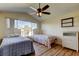 Bright bedroom with water views, wood-look floors, and comfortable twin beds, creating a relaxing retreat at 3805 Baden Dr, Holiday, FL 34691