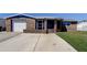 Charming single-story home with a brick exterior, attached garage, and well-maintained lawn at 3805 Baden Dr, Holiday, FL 34691