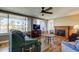 Cozy living room boasts waterfront views, fireplace, and comfortable seating, ideal for relaxation at 3805 Baden Dr, Holiday, FL 34691