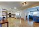 Bright, open living space with tile floors that seamlessly connects to the modern kitchen at 3805 Baden Dr, Holiday, FL 34691