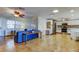 Spacious open-concept living space with tile flooring connecting the living room and kitchen at 3805 Baden Dr, Holiday, FL 34691