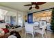 A bright sun room with tile floors and views of the outdoors at 3805 Baden Dr, Holiday, FL 34691