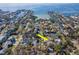 Stunning aerial view of waterfront community with lush greenery and tranquil canals at 4809 W Juno St, Tampa, FL 33629