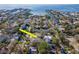 Wonderful aerial view of a residential area with lush trees and waterfront access in a coveted neighborhood at 4809 W Juno St, Tampa, FL 33629