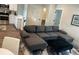 Inviting living space with modern sofa, neutral color palette, and great flow to kitchen and dining area at 4809 W Juno St, Tampa, FL 33629