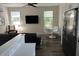 Bright living room featuring modern finishes, stainless steel appliances, and plenty of natural light at 4809 W Juno St, Tampa, FL 33629