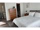 Serene bedroom with an ensuite bathroom, walk-in closet, wood-look floors and comfortable furniture at 4809 W Juno St, Tampa, FL 33629