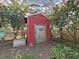 Quaint shed surrounded by lush landscaping and trees at 507 7Th Ne Ave, Largo, FL 33770