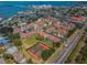 Aerial view of a waterfront community featuring tennis courts and a pool, perfect for active lifestyles at 538 Walden Ct, Dunedin, FL 34698