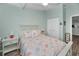 Comfortable bedroom featuring light walls and coastal decor, ceiling fan, and closet at 538 Walden Ct, Dunedin, FL 34698