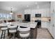 Modern kitchen with granite countertops, stainless steel appliances, and a center island with barstool seating at 538 Walden Ct, Dunedin, FL 34698