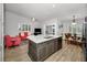 Open concept living area with kitchen island and living room combination providing a seamless flow at 538 Walden Ct, Dunedin, FL 34698