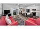 Open-concept living room and kitchen with modern décor and hardwood floors at 538 Walden Ct, Dunedin, FL 34698
