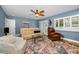 Comfortable living room with white sofa, leather recliner, and stylish decor at 538 Walden Ct, Dunedin, FL 34698