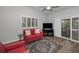 Inviting living room with comfortable seating, stylish rug, and bright natural light at 538 Walden Ct, Dunedin, FL 34698
