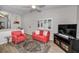 Bright living area featuring vaulted ceilings, comfortable seating, and modern entertainment center at 538 Walden Ct, Dunedin, FL 34698
