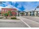 Charming street view with unique architecture and a welcoming 'Defending Freedom' arch at 538 Walden Ct, Dunedin, FL 34698