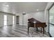 Spacious living room featuring wood floors and a sliding glass door at 5813 26Th N Ave, St Petersburg, FL 33710