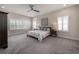Spacious bedroom featuring soft carpet, plantation shutters and ceiling fan at 6915 Sea Stone Ct, Apollo Beach, FL 33572