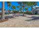 Community area with Adirondack chairs, pavers, and palm trees at 6915 Sea Stone Ct, Apollo Beach, FL 33572