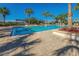 Beautiful community pool surrounded by lush landscaping and comfortable seating at 6915 Sea Stone Ct, Apollo Beach, FL 33572