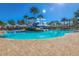 Community pool with a water slide and tower, surrounded by lush landscaping at 6915 Sea Stone Ct, Apollo Beach, FL 33572