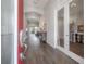 Welcoming foyer with hardwood floors leading to a living area and dining space at 6915 Sea Stone Ct, Apollo Beach, FL 33572