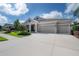 Attractive one-story home with a three car garage and large concrete driveway at 6915 Sea Stone Ct, Apollo Beach, FL 33572