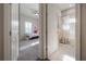 Hallway view with the bedroom on the left and a full bathroom on the right at 6915 Sea Stone Ct, Apollo Beach, FL 33572