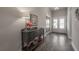 Welcoming hallway with decorative accents, a buffet table, and wood-look floors at 6915 Sea Stone Ct, Apollo Beach, FL 33572