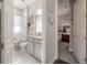 Hallway view with the bathroom on the left and a bedroom in the background at 6915 Sea Stone Ct, Apollo Beach, FL 33572